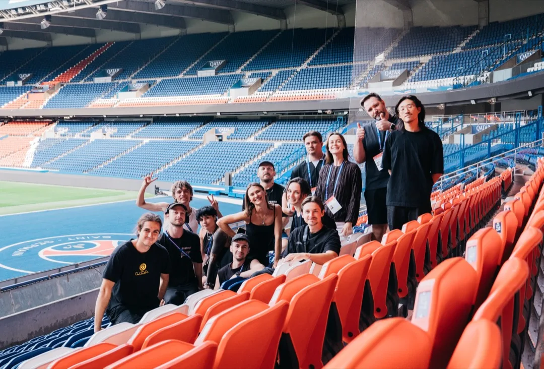 The Zing production team posing in the stands of the Parc des Princes