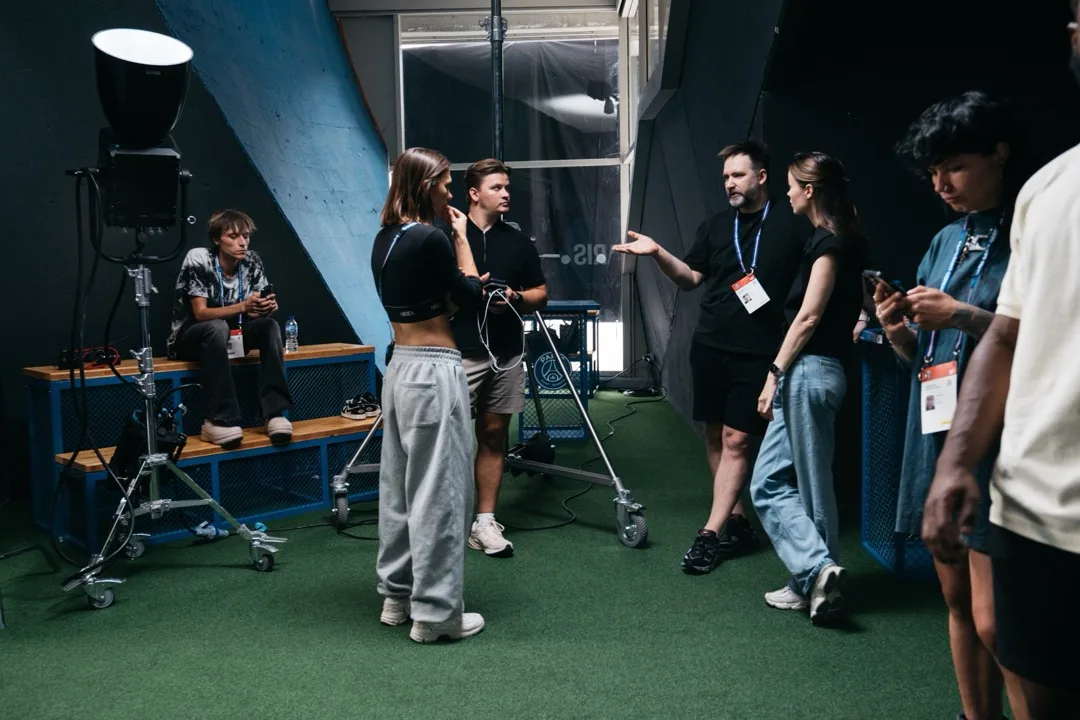 Production team discussing the next setup between takes at the stadium location